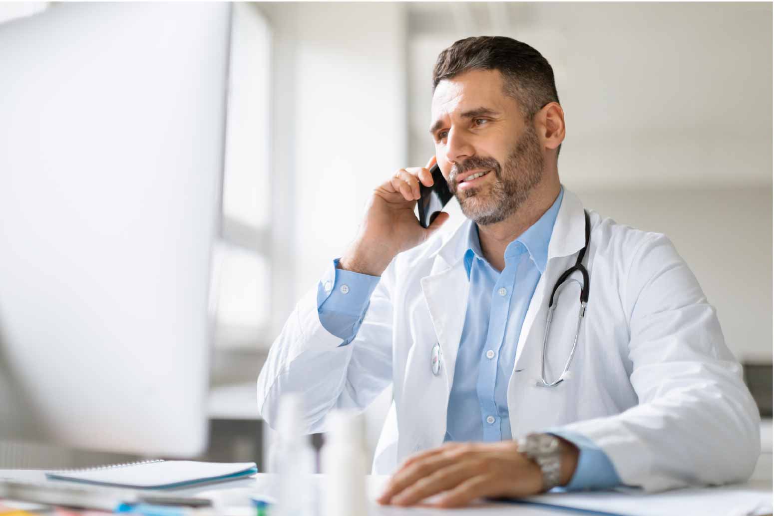 1.1 cheerful-professional-male-doctor-having-mobile-conversation-with-sick-patient-giving-01