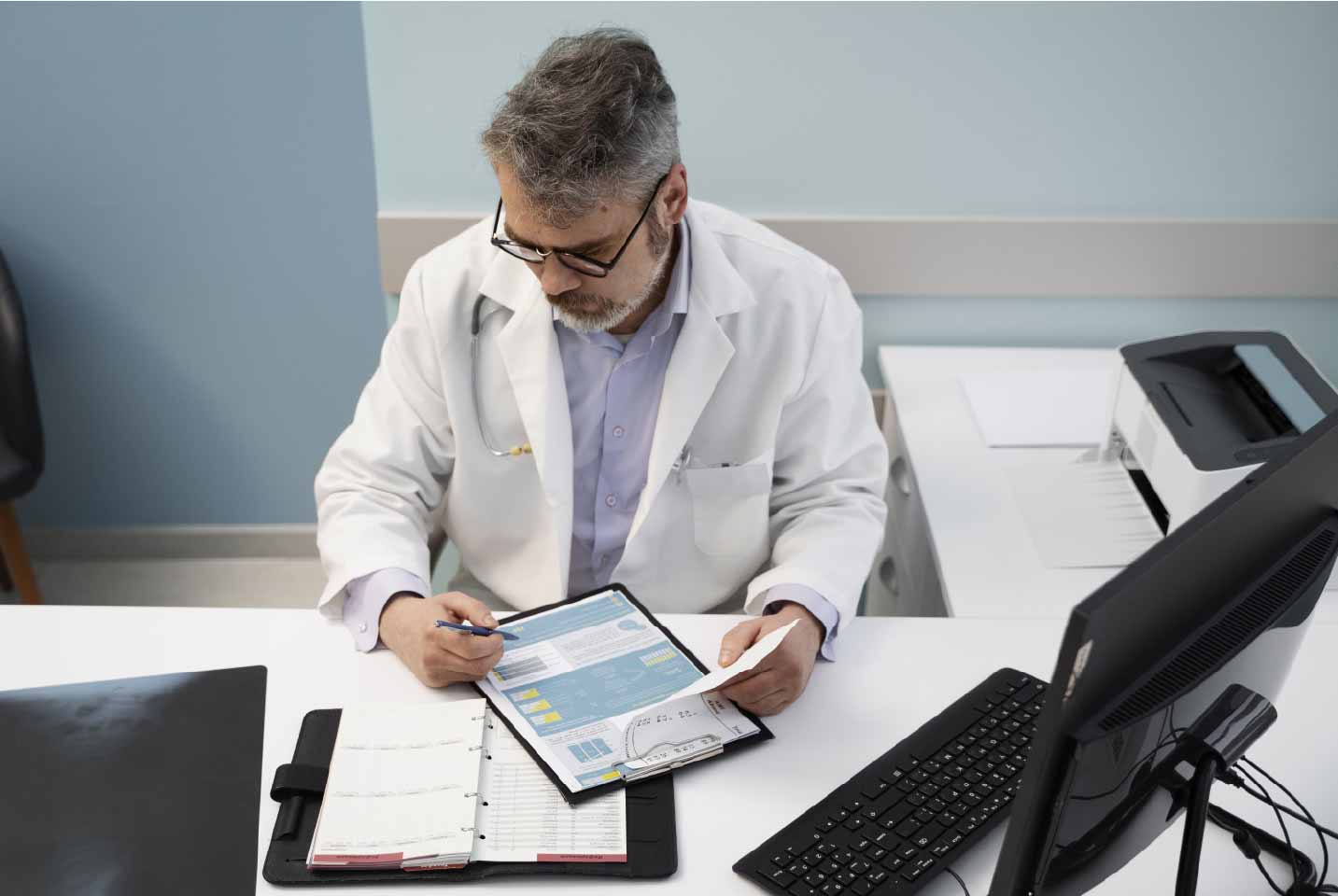 9.1 medium-shot-doctor-filling-document-high-angle-01